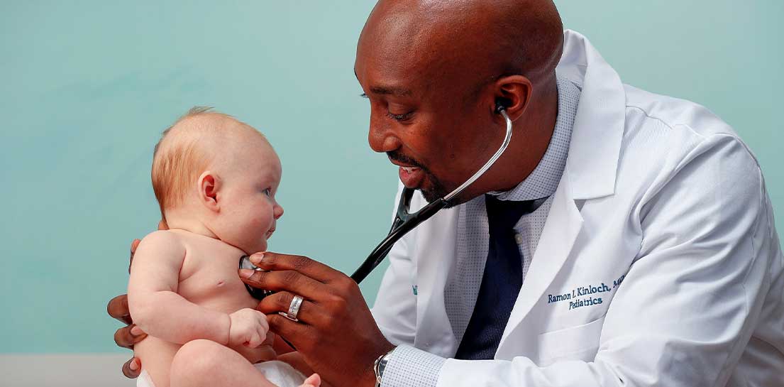 Doctor with infant